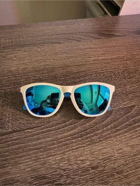 Oakley White Frame Sunglasses with Blue Mirrored Lenses